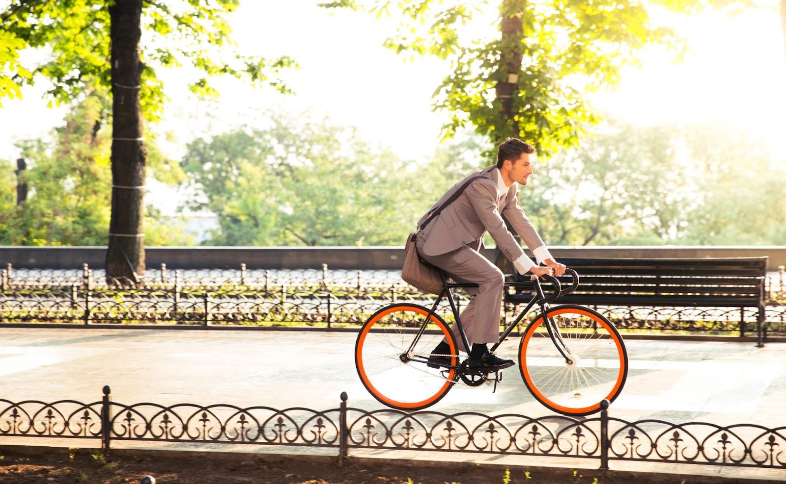 A businessman biking to work